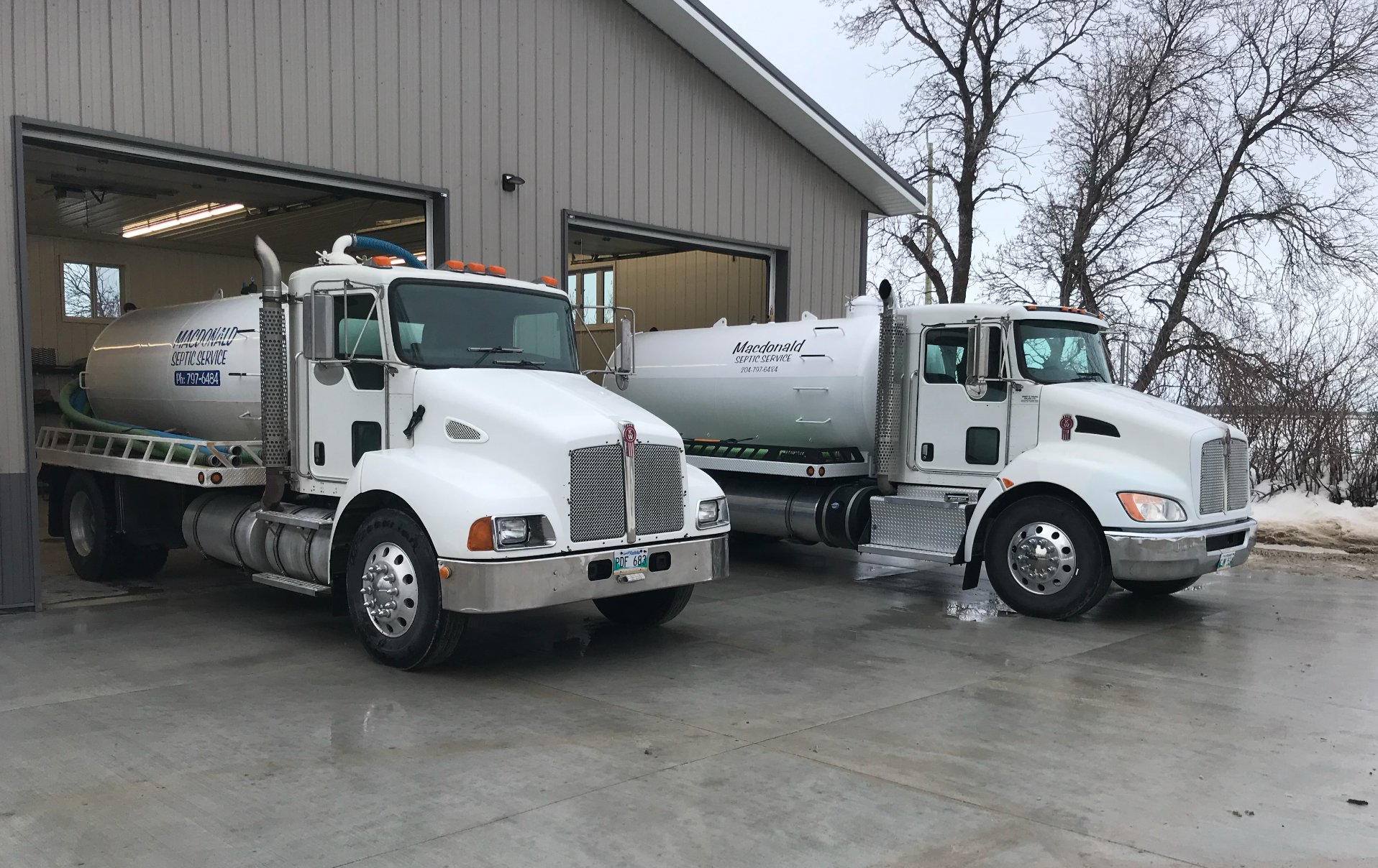 Macdonald Septic trucks at the shop in winter