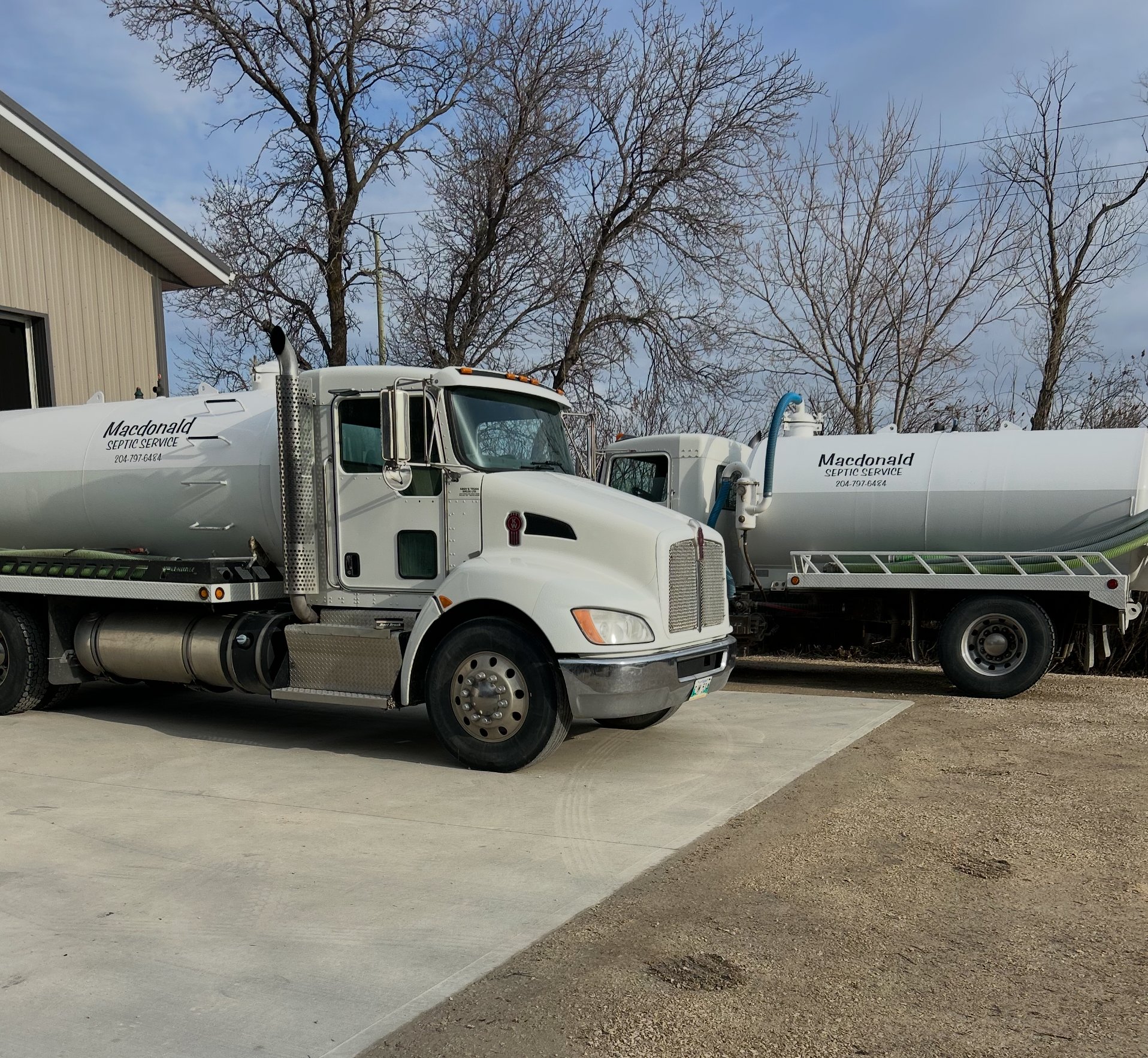 Macdonald Septic trucks in the yard